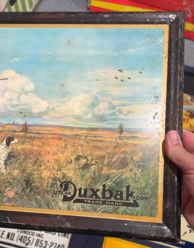 Utica Duxbak Corporation Hunter with Dog TOC Sign