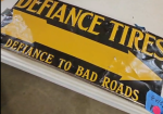 Defiance Tires Defiance to Bad Roads Directional Arrow SST Embossed Sign