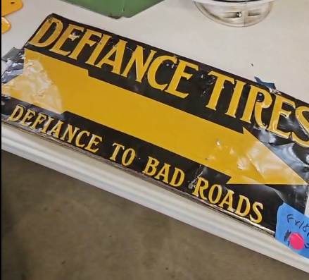 Defiance Tires Defiance to Bad Roads Directional Arrow SST Embossed Sign