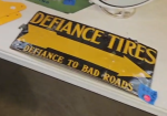 Defiance Tires Defiance to Bad Roads Directional Arrow SST Embossed Sign