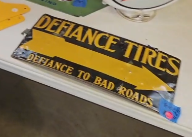 Defiance Tires Defiance to Bad Roads Directional Arrow SST Embossed Sign