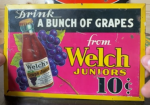 Welch’s Juniors 10 Cents Tin Over Cardboard Sign