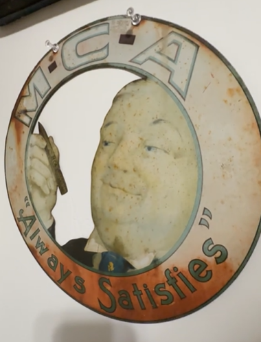 MCA Cigars Always Satisfies Goldsmith Silver & Co Die Cut SST Sign