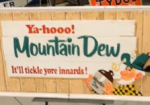 Mountain Dew It’ll Tickle Yore Innards SST Embossed Sign