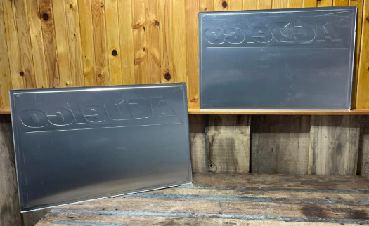 Two AC Delco Batteries Aluminum Embossed Signs