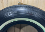 Atlas Tire Stand SST Sign and Tire