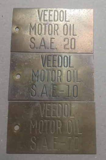 Three Brass Veedol Motor Oil Tags