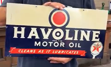 Texaco Havoline Motor Oil Cleans as it Lubricates Rack Sign