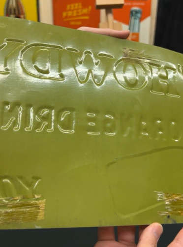 Howdy Orange Drink Good for You SST Embossed Sign