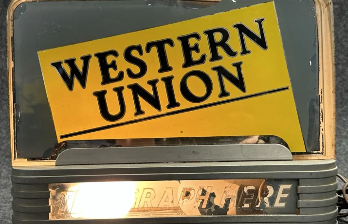 Western Union “Telegraph Here” Reverse Glass Painted Countertop Lighted Display Sign