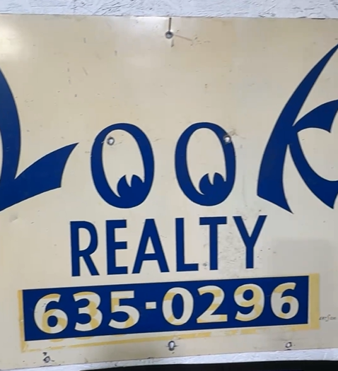 Cowen Moving and Storage and Look Realty DST Real Estate Sign