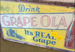 Drink Grape Ola It’s Real Grape SST Embossed Sign