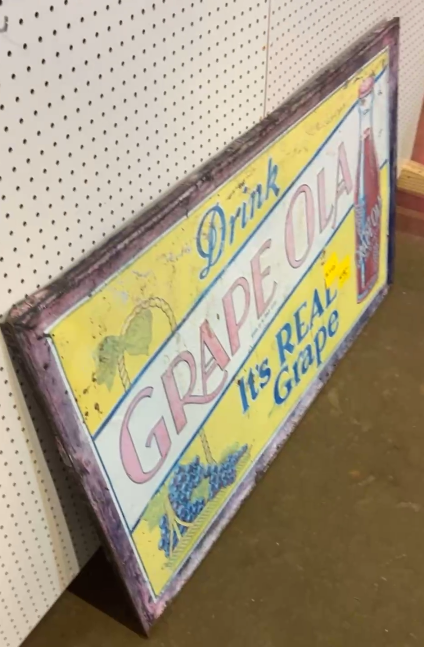 Drink Grape Ola It’s Real Grape SST Embossed Sign