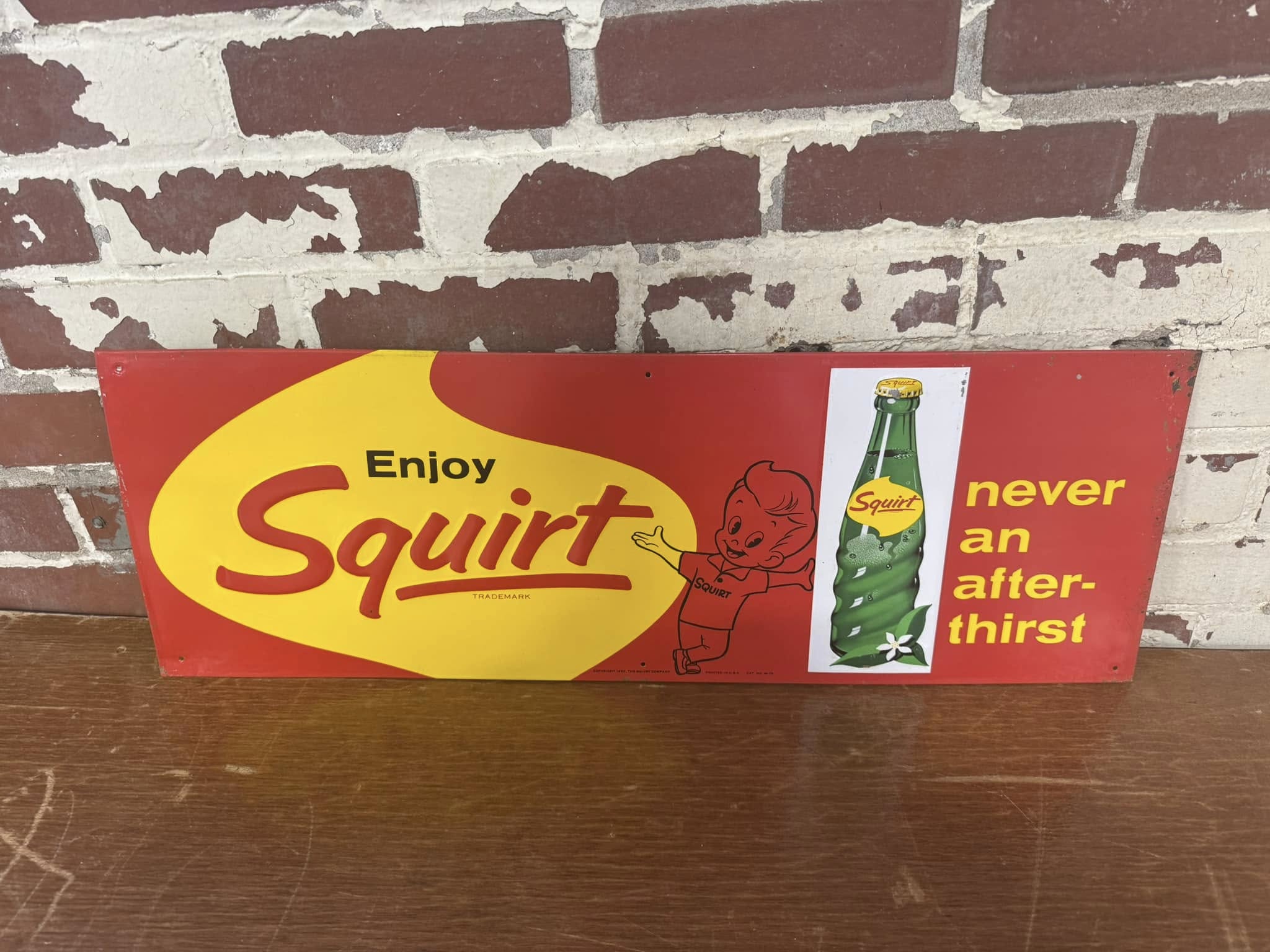 Enjoy Squirt SST Embossed Sign