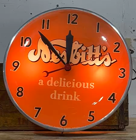 Nesbitt’s Orange a Delicious Drink Glass Faced Clock