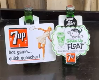 Two 7Up Cardboard/Paper Bottle Toppers