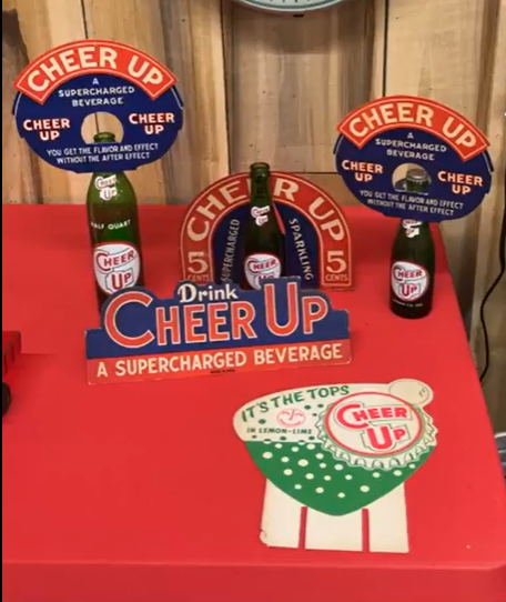Cheer Up Supercharged Beverage Bottle Toppers Sign and Bottle Displays