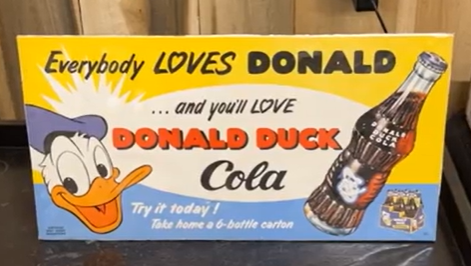 Donald Duck Cola Paper Sign with Two Bottles
