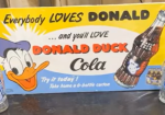 Donald Duck Cola Paper Sign with Two Bottles
