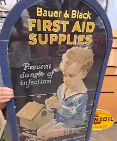 Bauer & Black First Aid Supplies Cardboard Sign