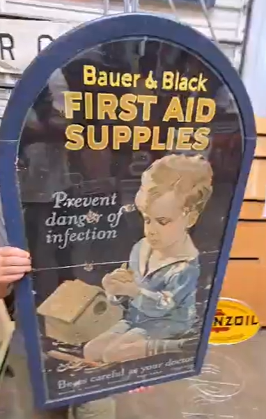 Bauer & Black First Aid Supplies Cardboard Sign